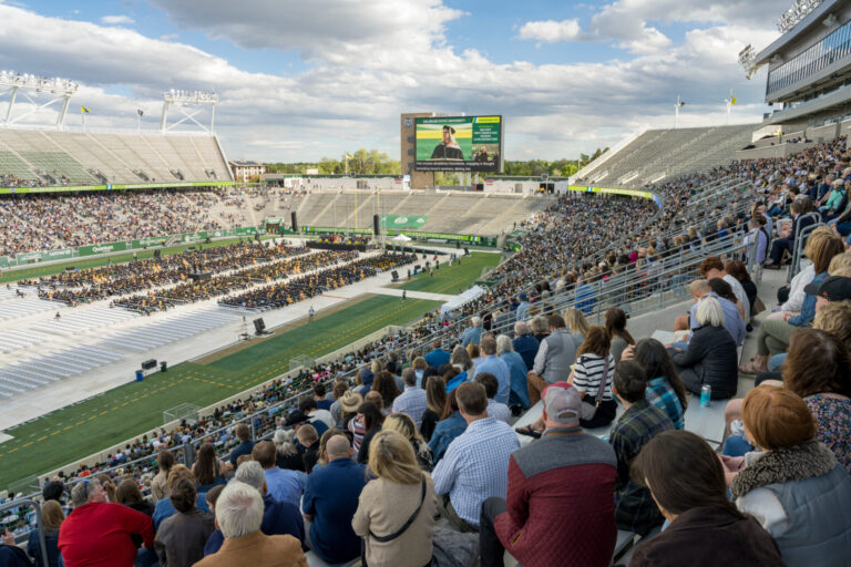 A view of Canvas Stadium with a crowd of guests and supporters in the foreground.