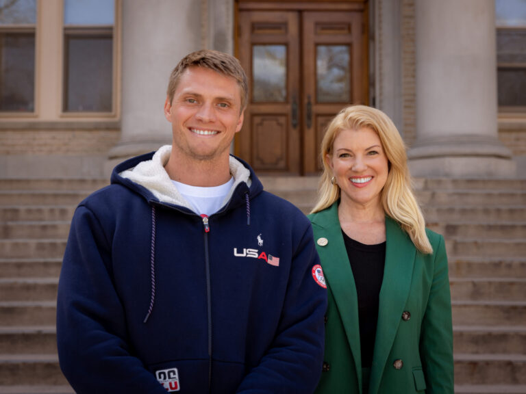 Hunter Powell and CSU President Amy Parsons on the front steps of the Admin building.